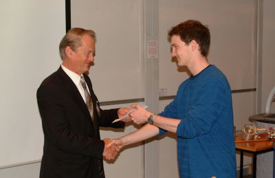 Ed Crammond receiving his prize from Philip Jenkinson